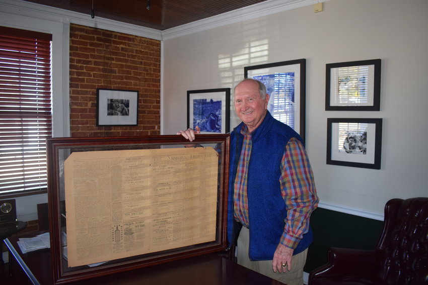 Neshoba County native Ray Humphreys poses with a framed original copy of the Dec. 3, 1885, edition of The Neshoba Democrat he gave to the newspaper.